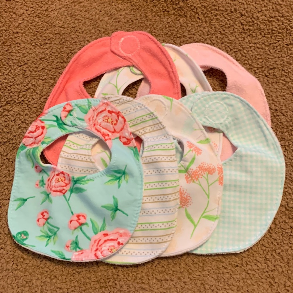 Set of 7 infant bibs.